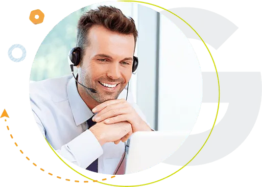 man in corporate attire calling and smiling