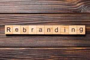 “rebranding” spelled in alphabet blocks