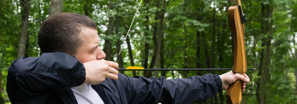 person pulling on an arrow’s bowstrings